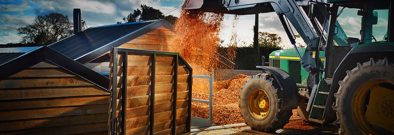 Tractor shoveling chip