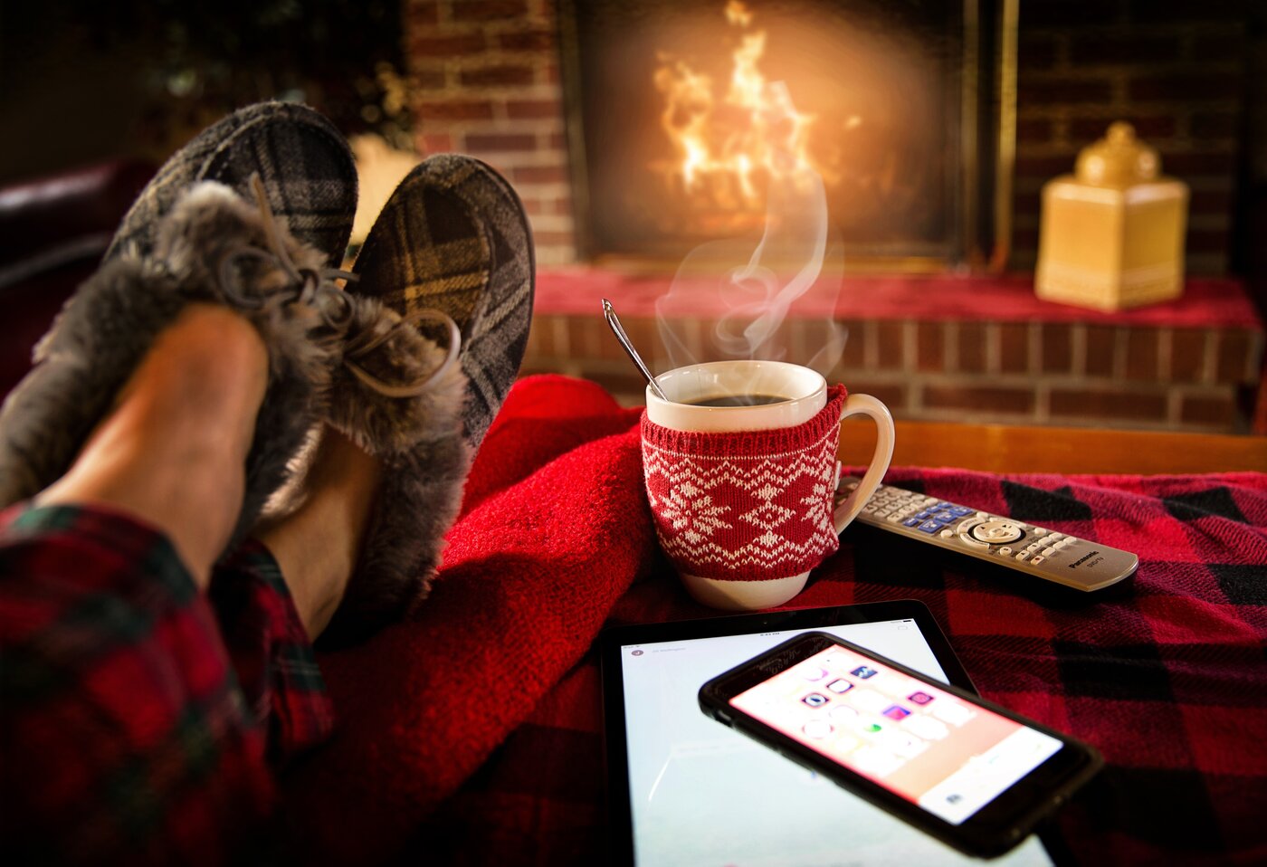 feet up with coffee in front of the fire